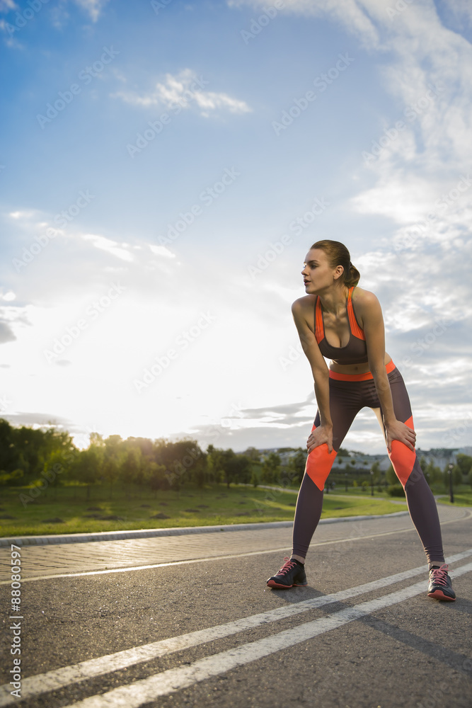 young woman in sportswear jogging