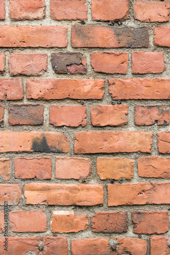 Old deteriorated red brick wall texture background