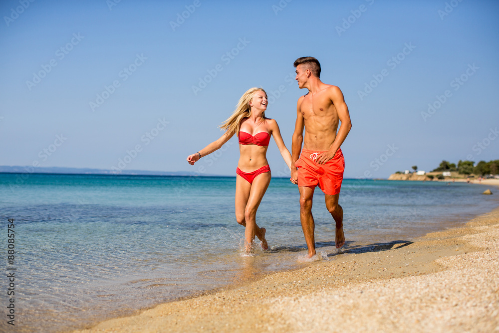 Young couple relaxing on the beach