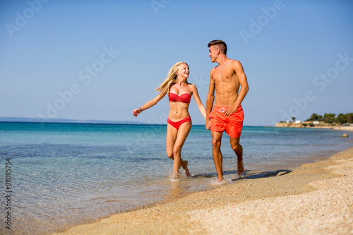 Young couple relaxing on the beach