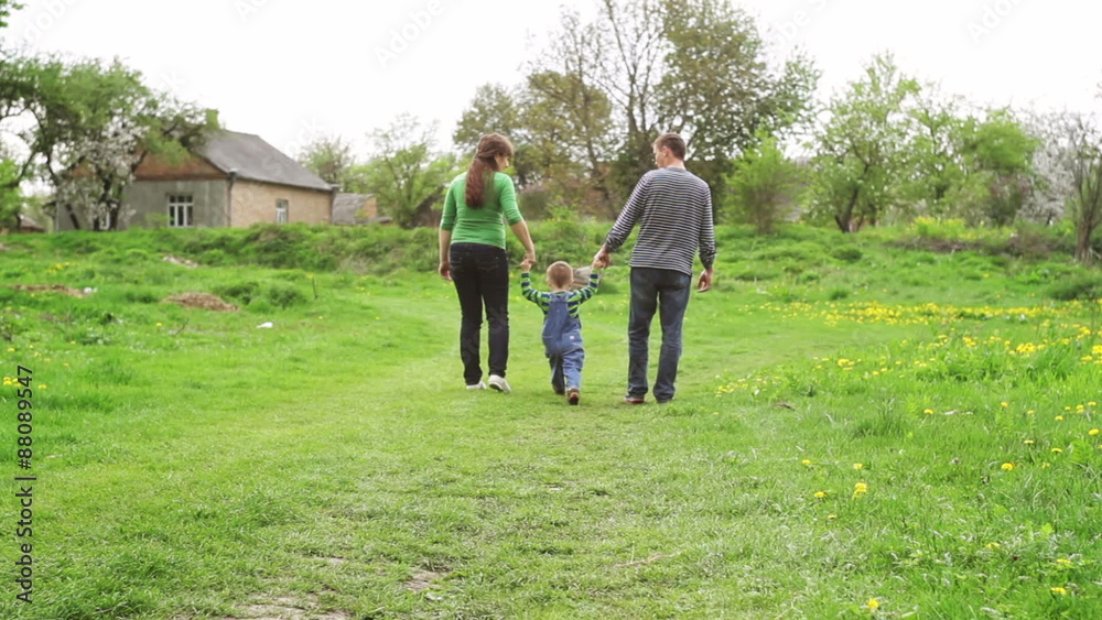 young family on the meadow at sunny day
young family on the meadow at sunny day