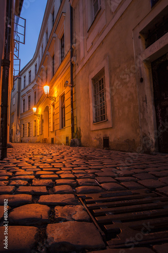 Prague street at night with sewer © addufek