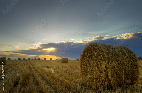 Haystacks.Sunset on the field