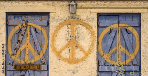 Peace sign repeated symbol on abandoned building