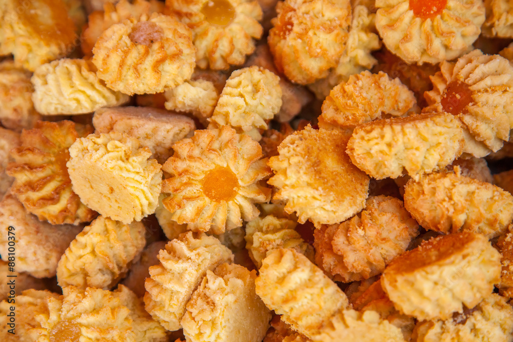 Kurabie cookies with apricot fruit jelly as a background for design Kurabie cookies with apricot fruit jelly as a background for design