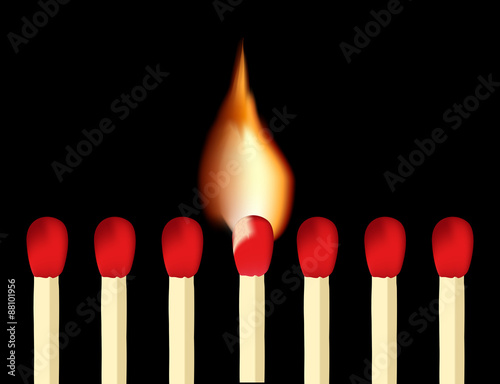 Matches and burning match on black background