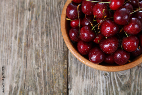Ripe cherry in a wooden bowl