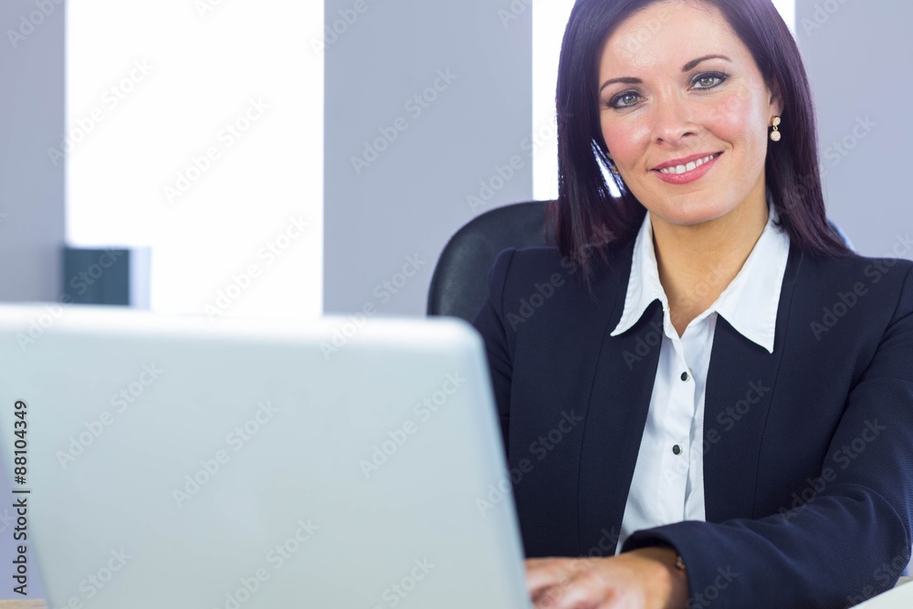 Businesswoman working at her desk Businesswoman working at her desk