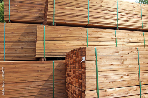 stack of wooden terrace planks at the lumber yard photo