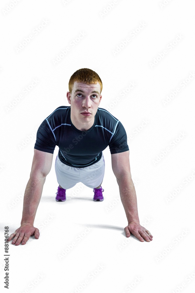 Muscular rugby player doing push ups Muscular rugby player doing push ups