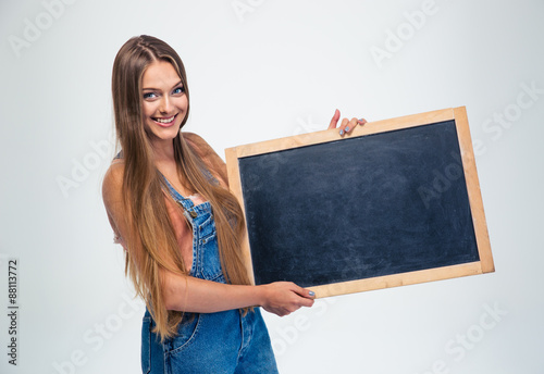Female student holding blank board