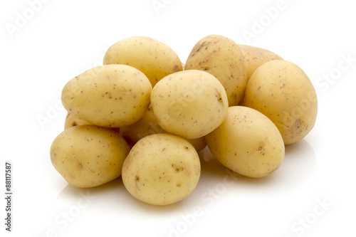 Potatoes on the white background.  New harvest.