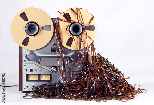 Open Reel Tape Deck Recorder Player with Messy Entangled Tape photo