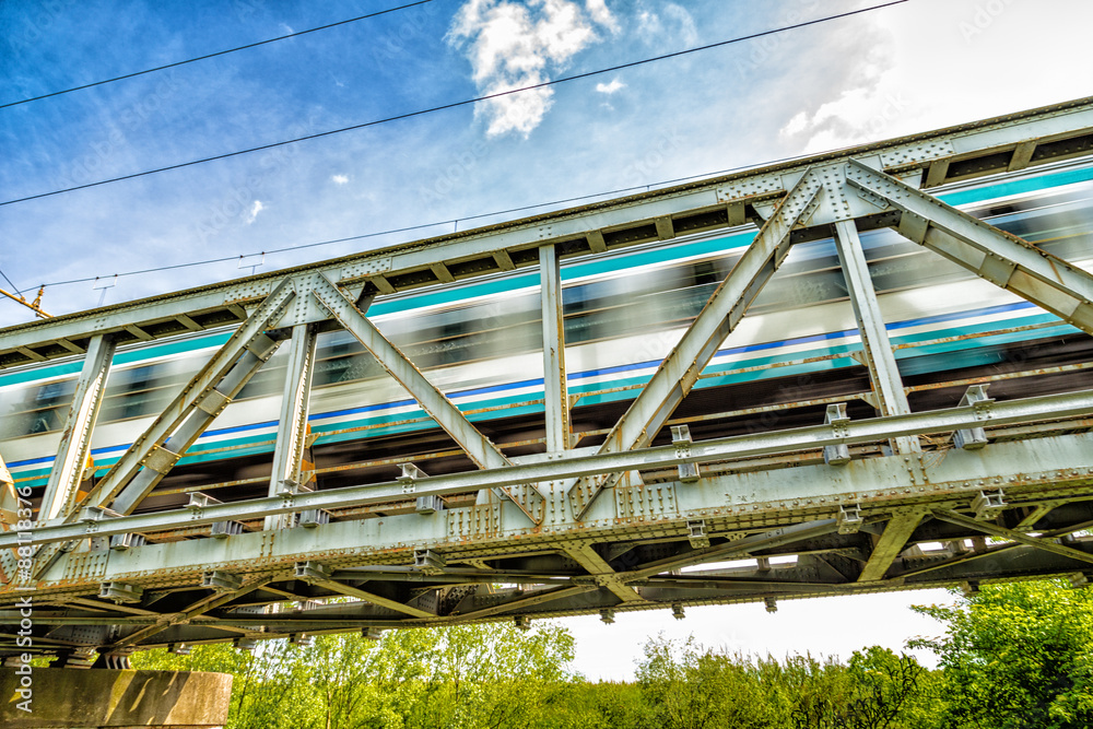Running train on iron bridge