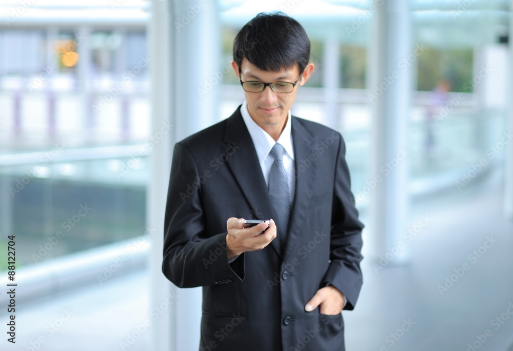 Man on smart phone - young business man. Casual urban profession Man on smart phone - young business man. Casual urban profession