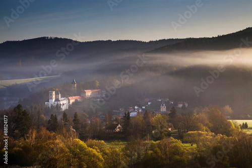 Rozmberk castle in the misty landscape