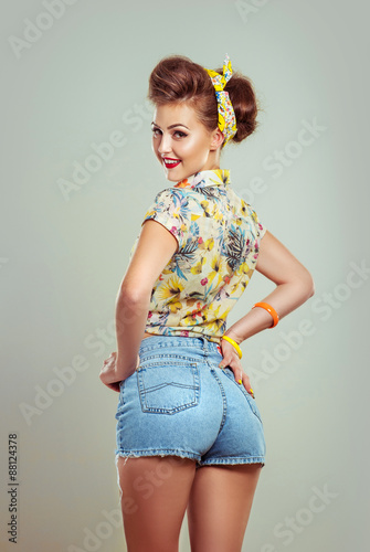 Glamour pin up girl looking over the shoulder