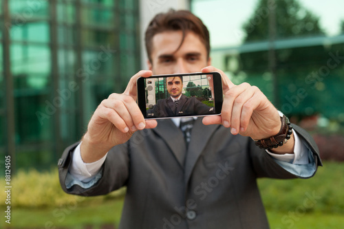 Businessman taking selfie