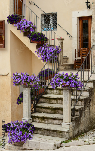 Townscape Scanno, stairs with surfiniya flowers photo