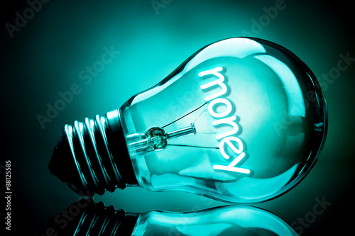 Light bulb on dark background photo