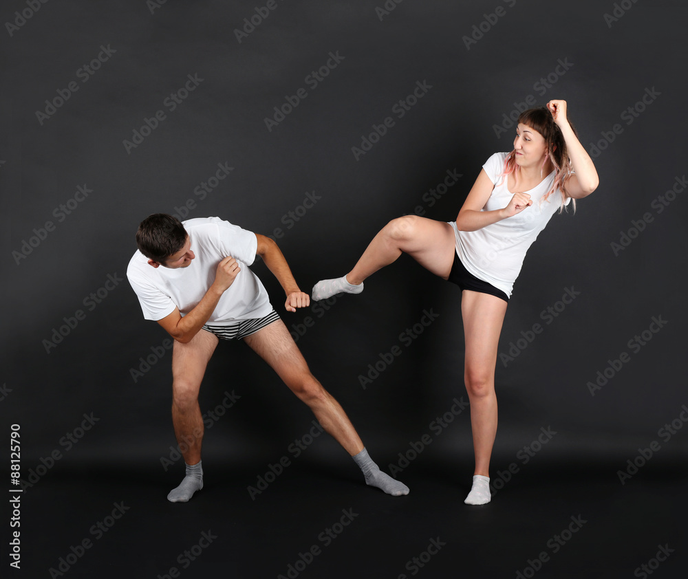 young couple on black background