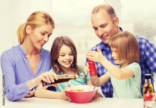 happy family with two kids eating at home