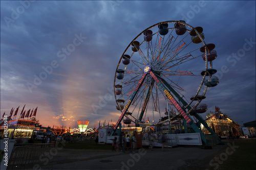 Ferris wheel at the fair at sunset