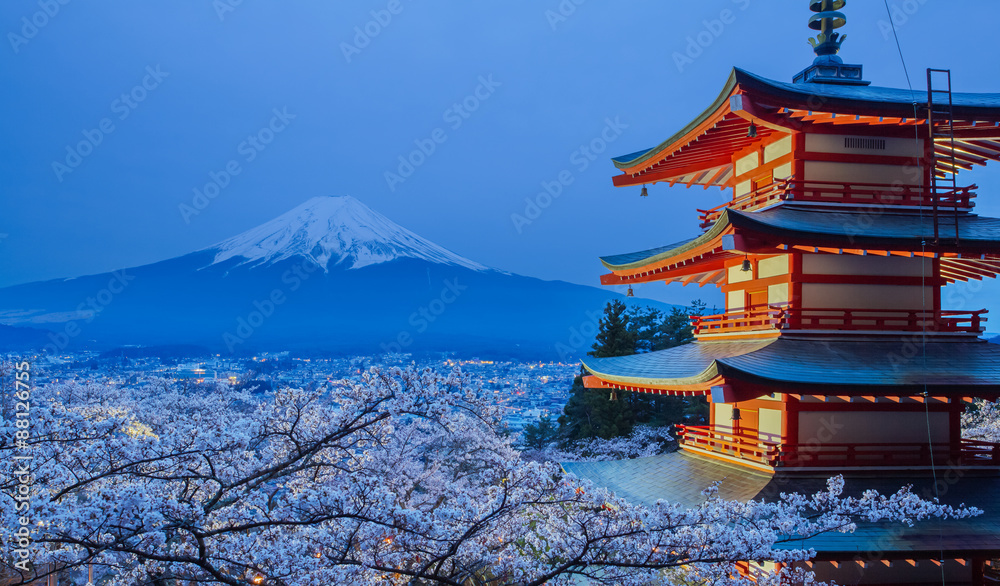Mountain Fuji and red pagoda evening light up in cherry blossom sakura season
