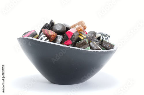 Black candy bowl filled with liquorice candy