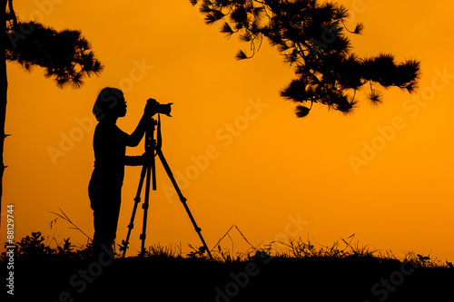 .Silhouette photographers take camera landscape