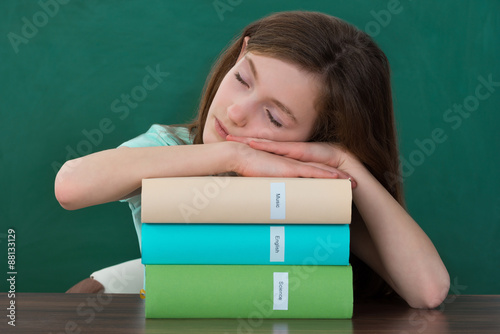 Girl With Books Sleeping At Desk