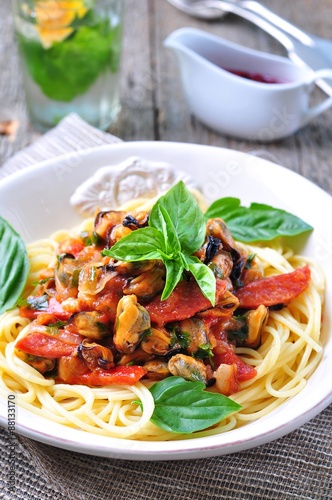 pasta with mussels, pepperoni, bacon, tomato and basil