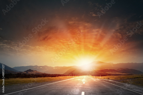 Sunrise above road