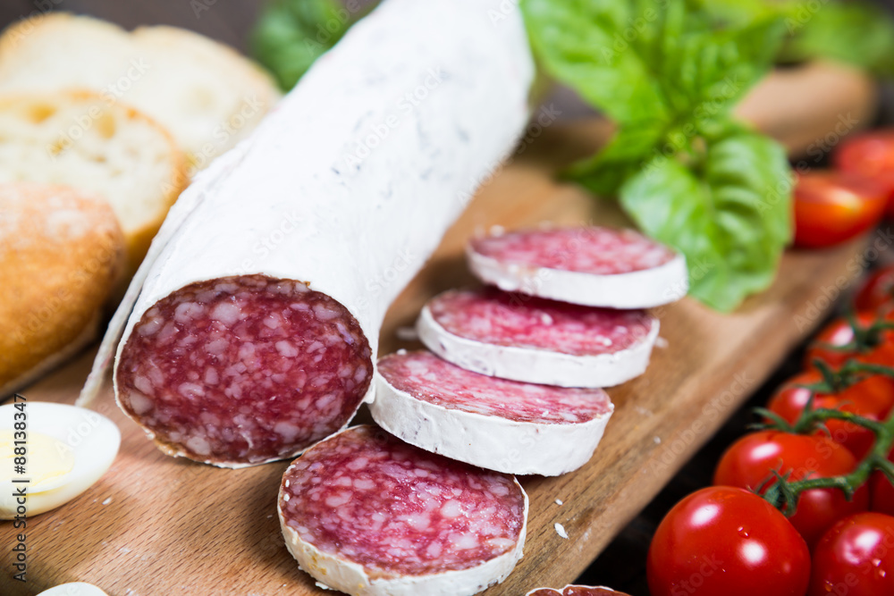 Salami bread with basil and cherry tomatoes Salami bread with basil and cherry tomatoes