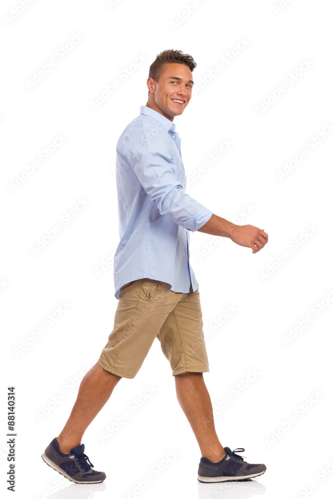 Young Man Walking. Full length studio shot isolated on white. Young Man Walking. Full length studio shot isolated on white.