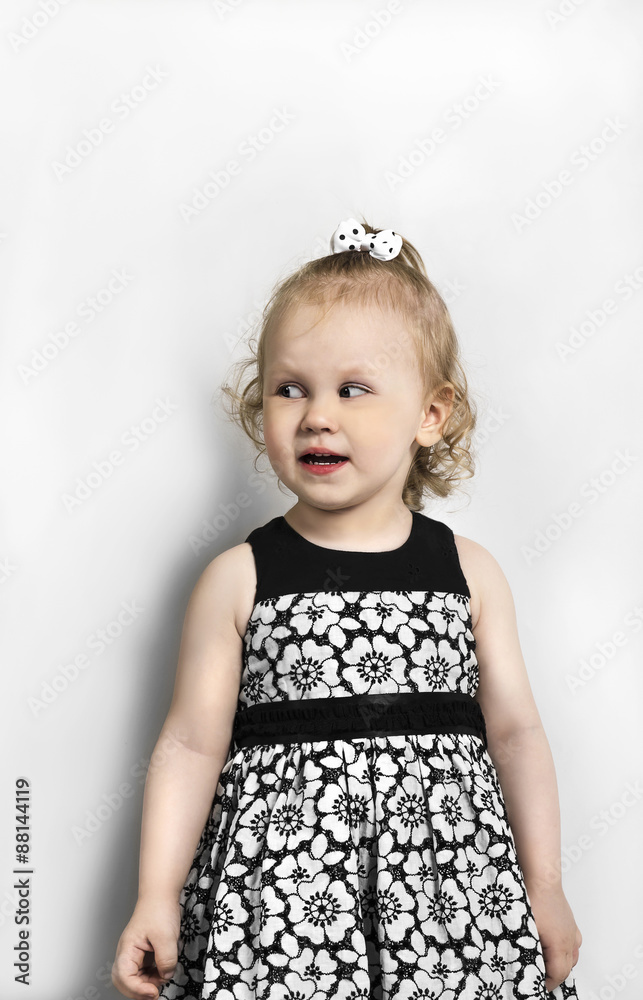 Little Girl in black and white dress standing Little Girl in black and white dress standing