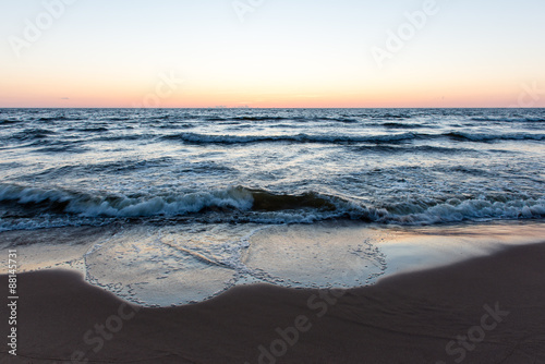 Fototapeta Naklejka Na Ścianę i Meble -  red dramatic sunset on the sea beach