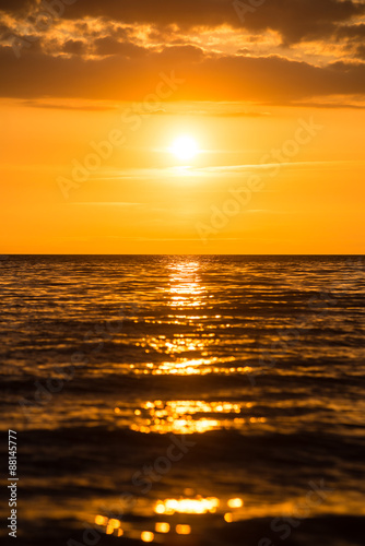 orange dramatic sunset on the sea beach