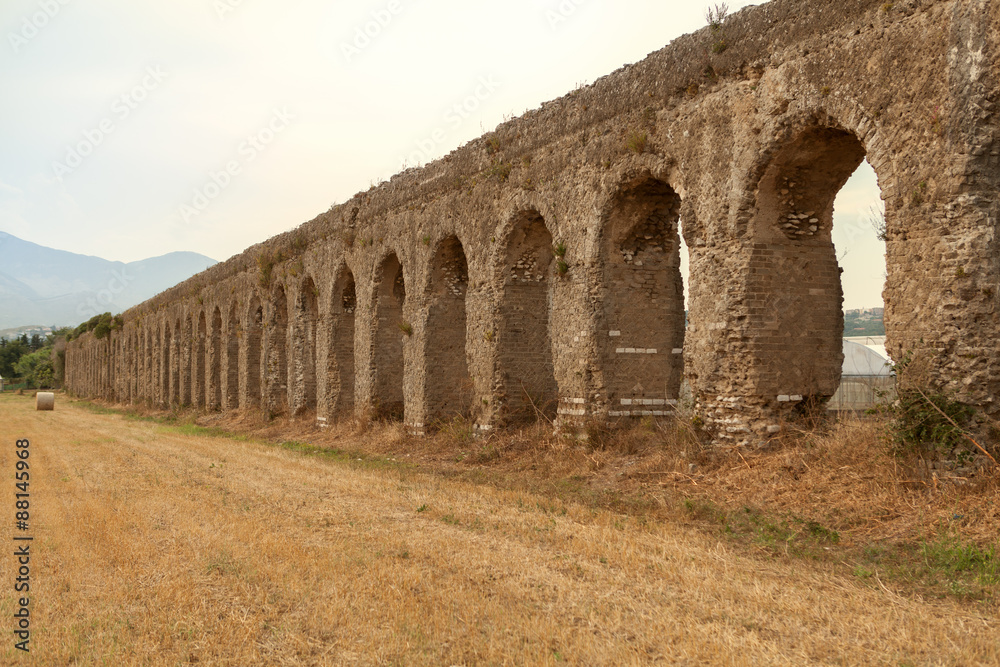 Photo of told aqueduct in Italy, ruins, yellow field