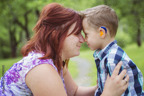 Mother and son in forest having fun