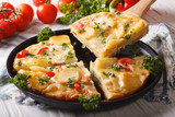 Pieces Spanish omelette with fried potatoes. Horizontal closeup
