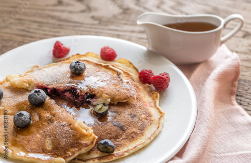 Pancakes with maple syrup and fresh berries