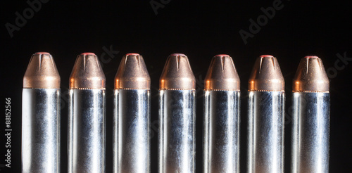Handgun cartridges with red tipped bullets