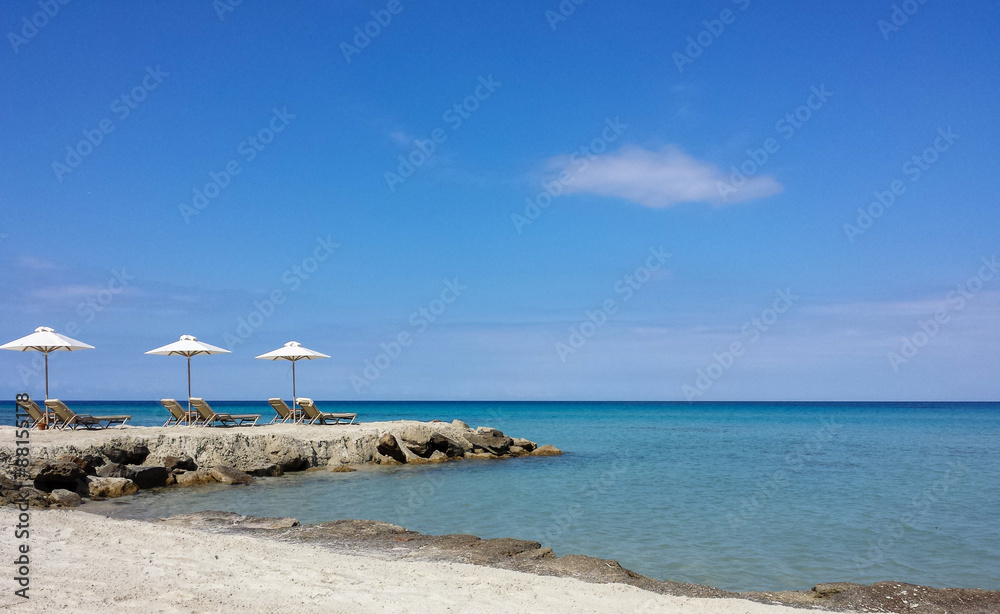 Relaxation on crystalline Mediterranean Sea on a white sand beac