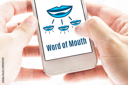 Obraz na plátně Close up Two hand holding smart phone with word of mouth online
