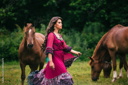 Beautiful gypsy in violet dress