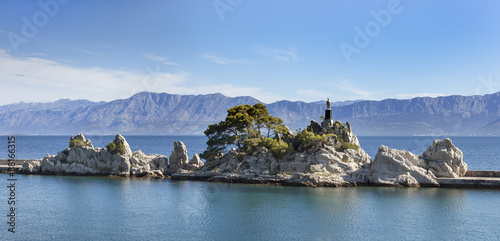 Принти на полотні Rocks with statue of St