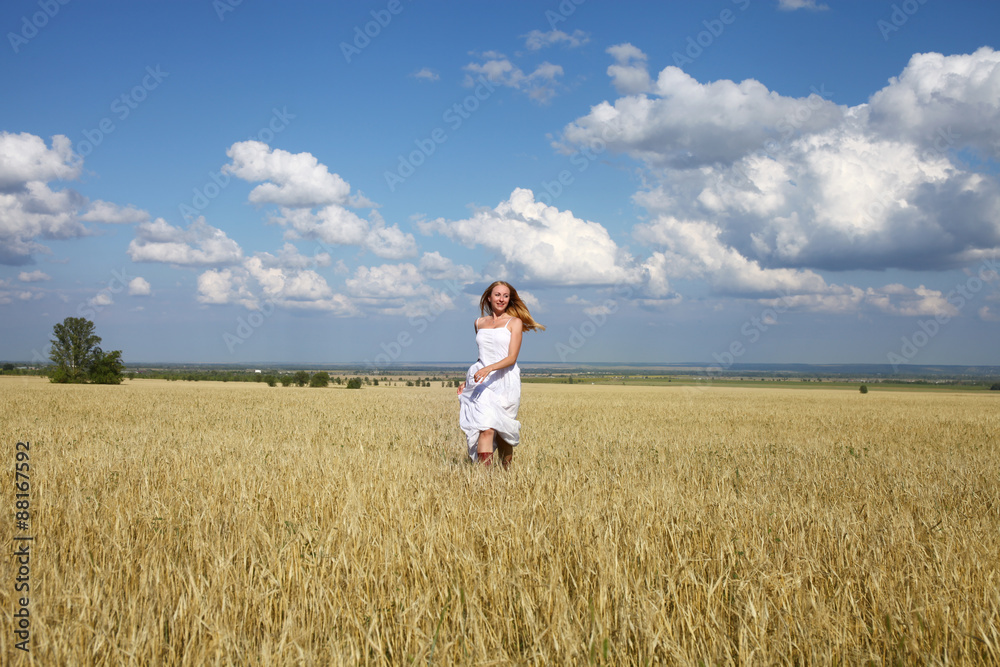 Full-length portrait of a beautiful young girl in a white dress Full-length portrait of a beautiful young girl in a white dress