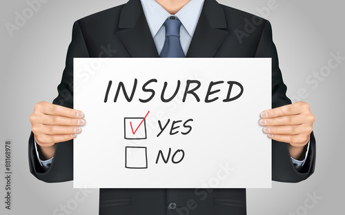 businessman holding yes insured poster