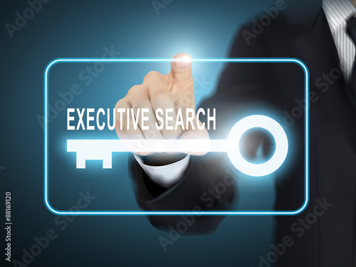 male hand pressing executive search key button